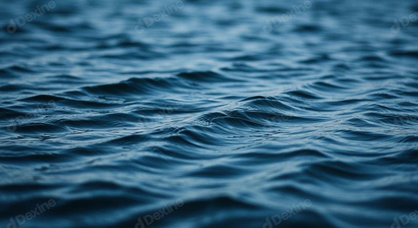 Dark Blue Water Surface With Gentle Ripples And Waves