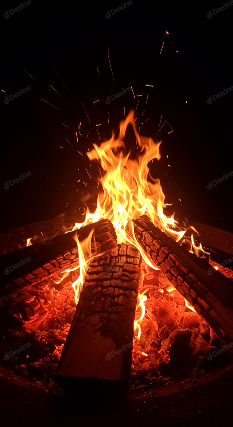 Vibrant Campfire Flames With Glowing Embers And Flying Sparks