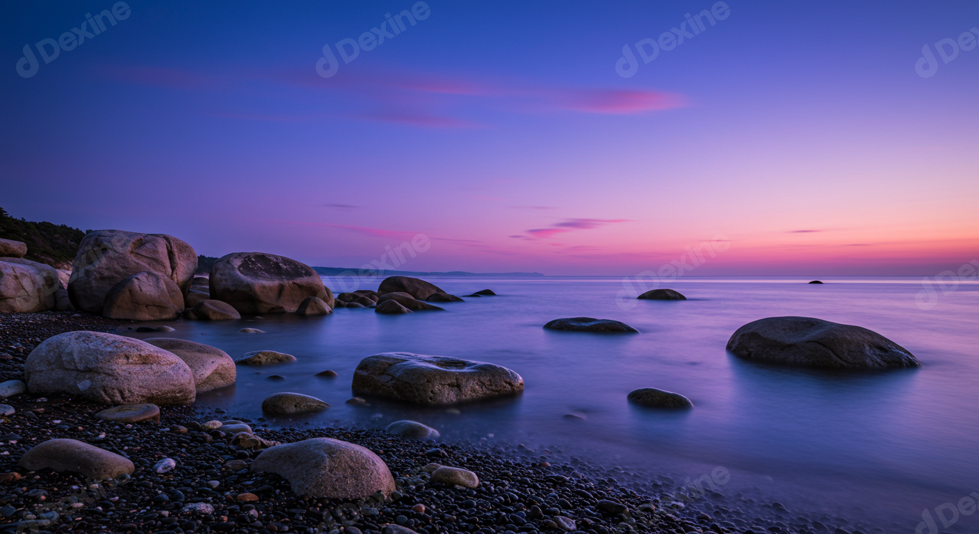 Vibrant Purple Sunset Over Tranquil Rocky Seashore