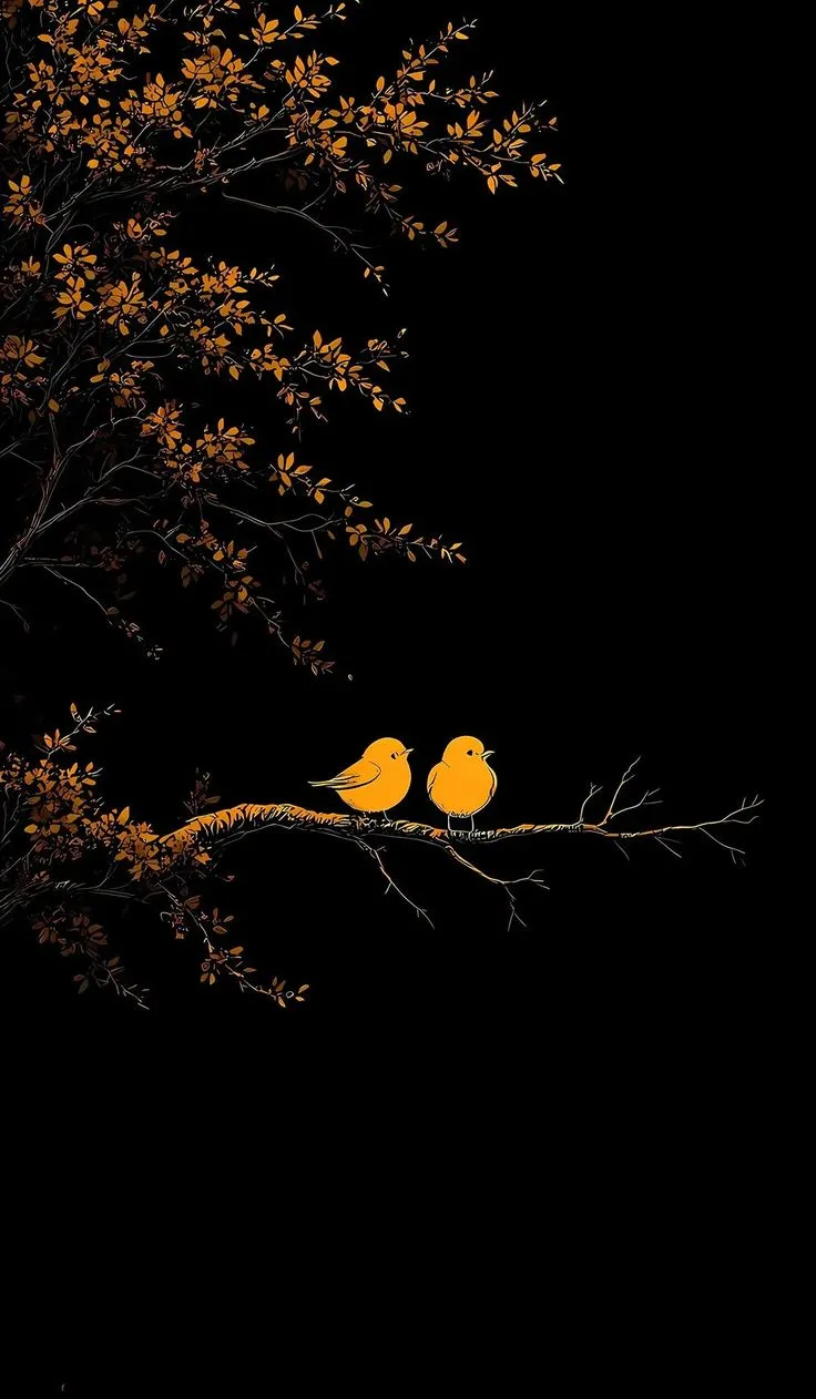 two yellow birds sitting on top of a branch in front of a black background with orange leaves
