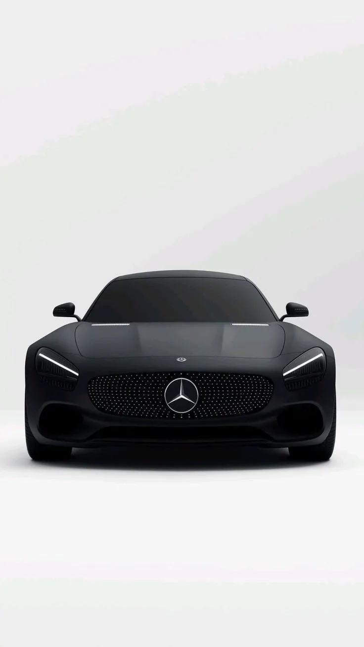 the front view of a black mercedes sports car on a white background with no people around it