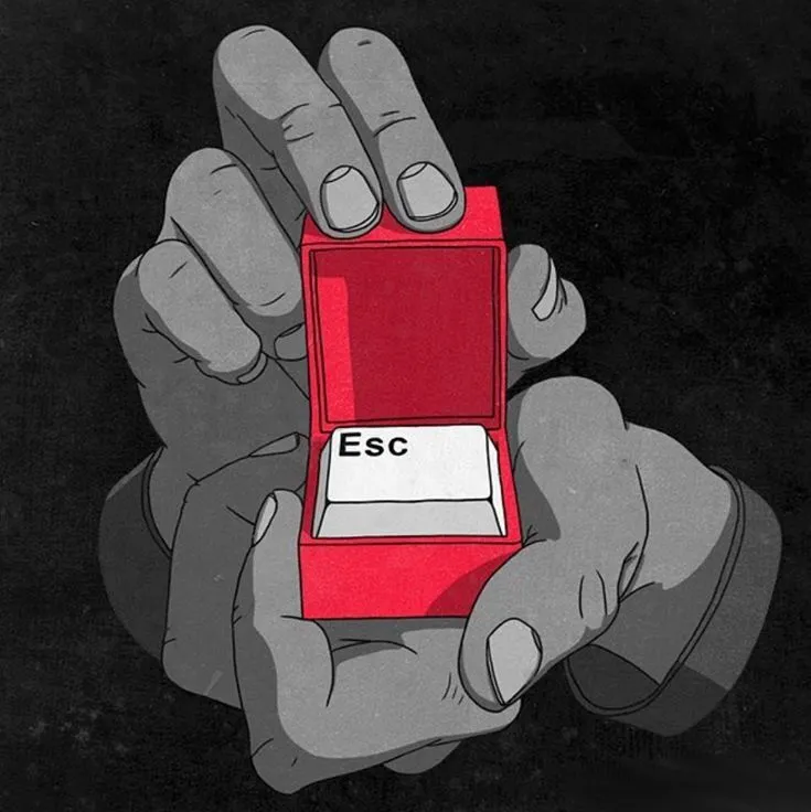 a person holding a red object in their hand with the word esc on it