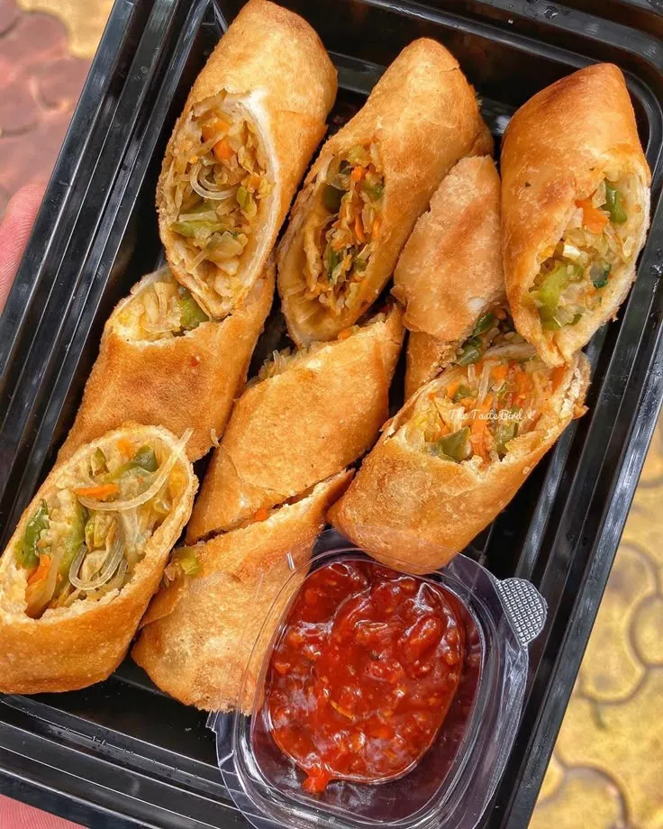 ARUSHI &amp; DEEPANSHU on Instagram: “Rain showers in Delhi calls for a plate of Hot and Spicy Vegetable Spring Rolls😍 What are you having or what do you Love Eating while its…”