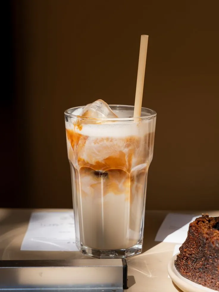 Iced chai latte in a designer glass