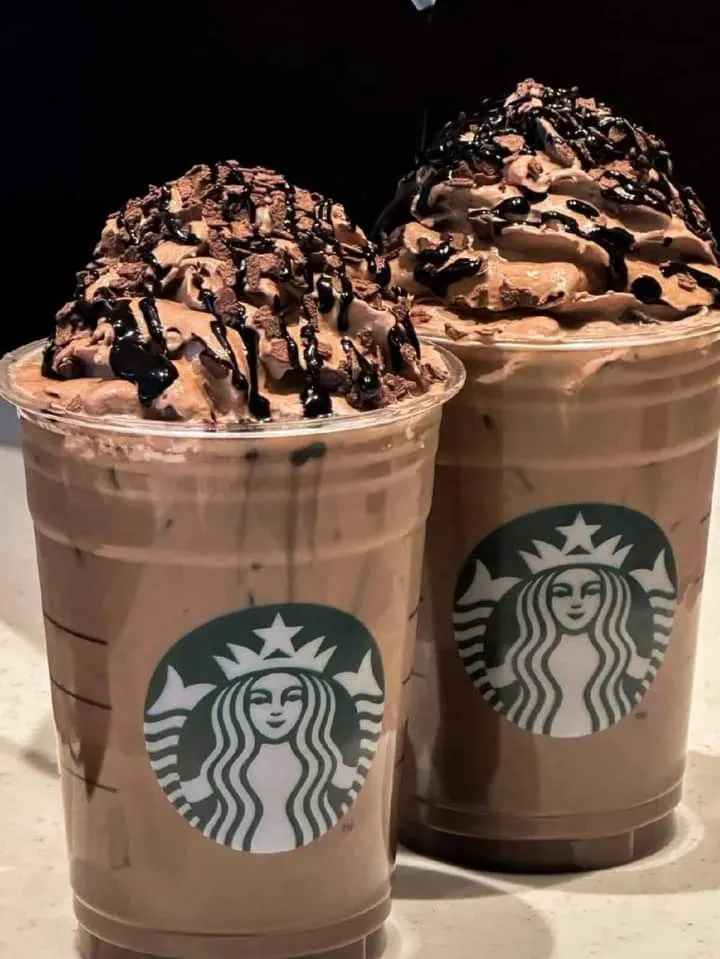 two cups filled with ice cream and chocolate