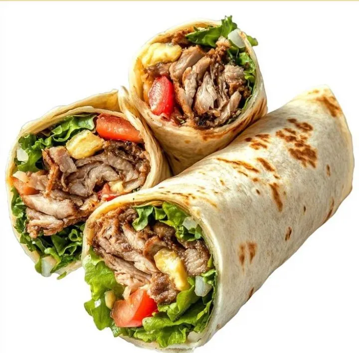 three burritos with meat, lettuce and tomatoes on them are cut in half