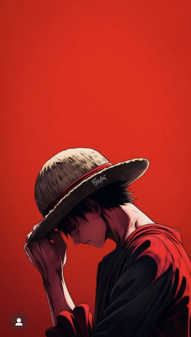 a man wearing a hat and holding his hand to his face against a red background