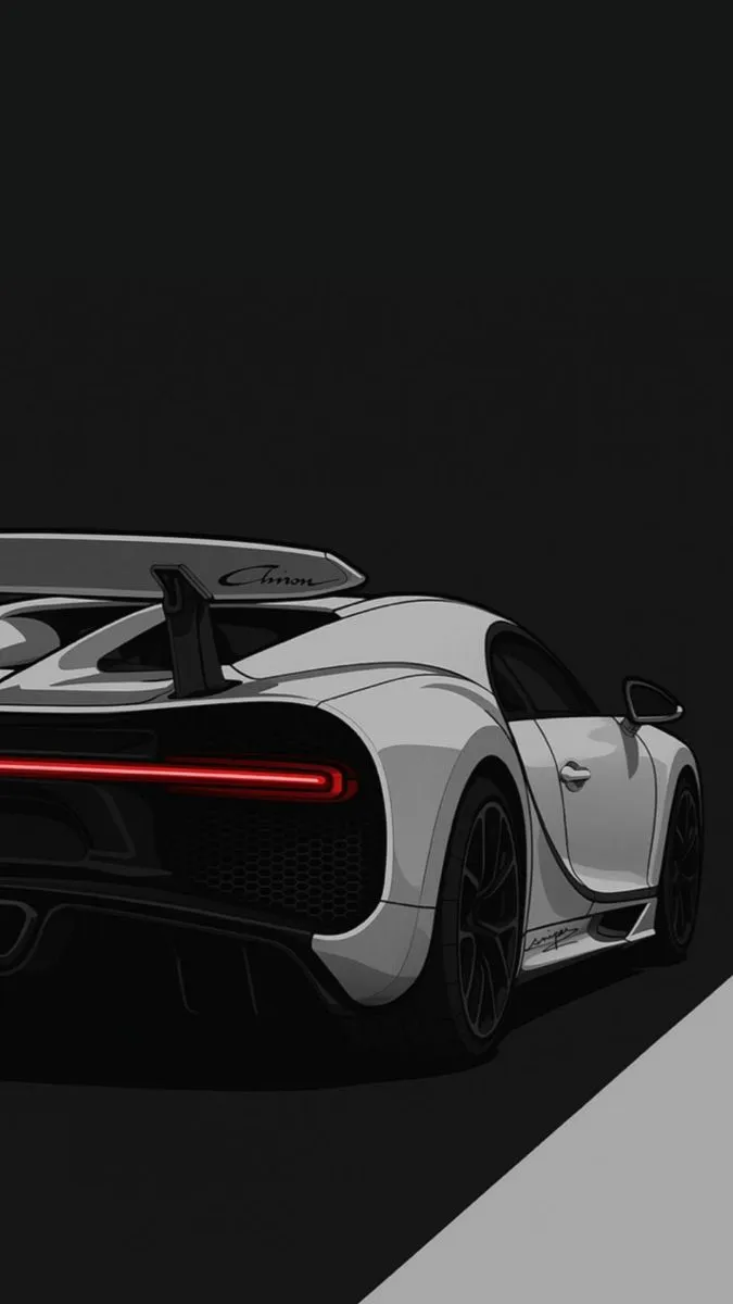 a white sports car is shown in the dark