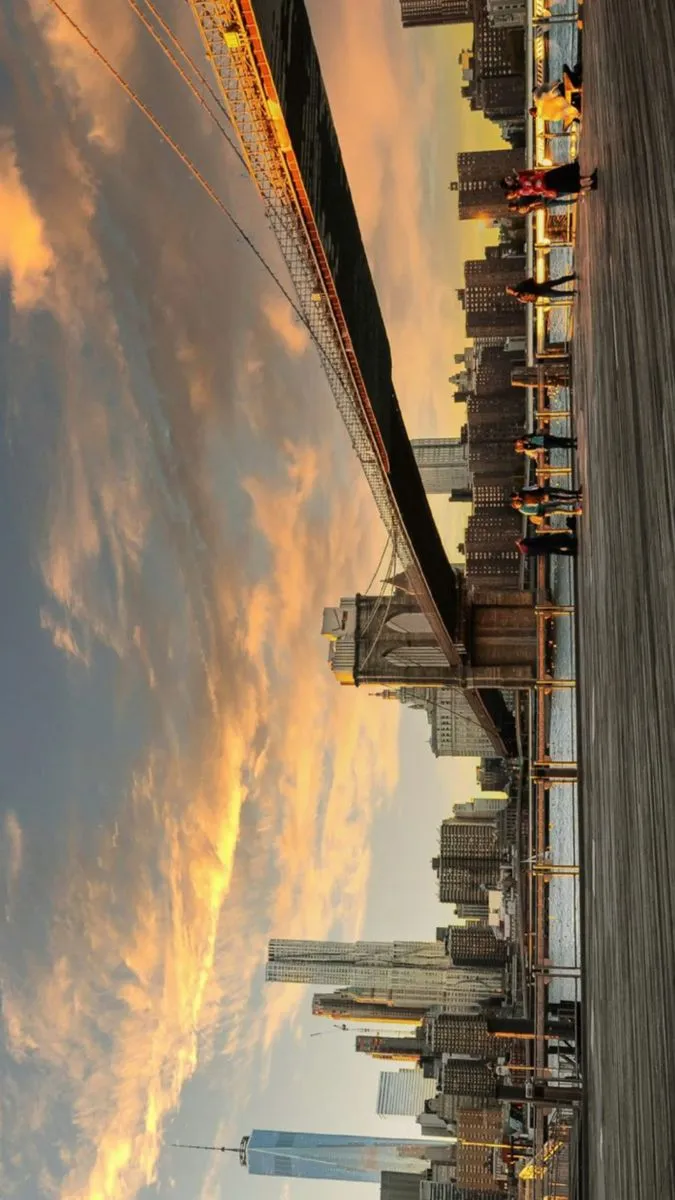 the sky is very cloudy and there are many buildings