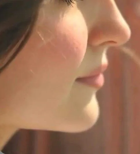 a close up of a person with long hair