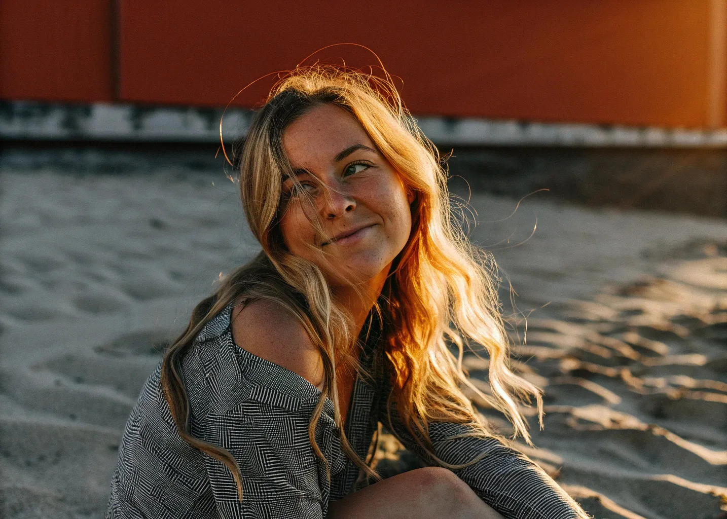 En face portrait of a beautiful 22-year-old smiling blonde with...