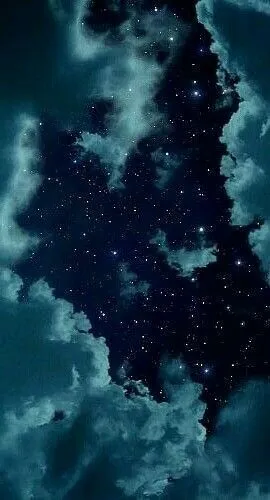 the night sky is filled with stars and clouds as if it were floating in space