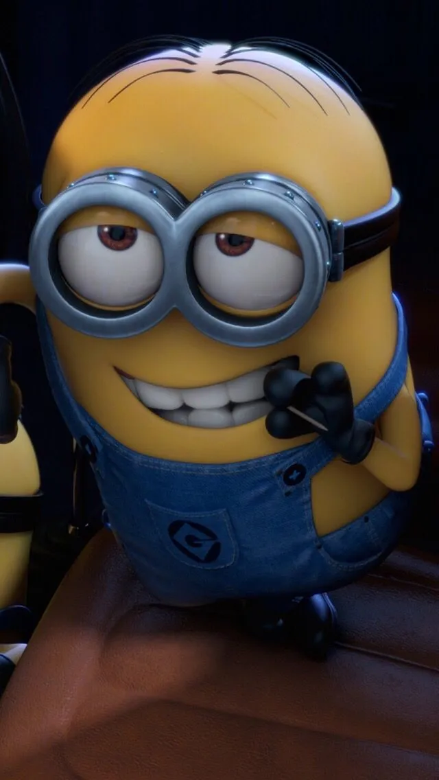 a minion sitting in the drivers seat of a car