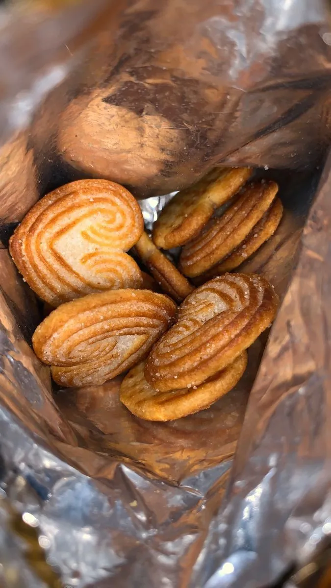 some kind of food that is in a bag on tin foil and ready to be eaten