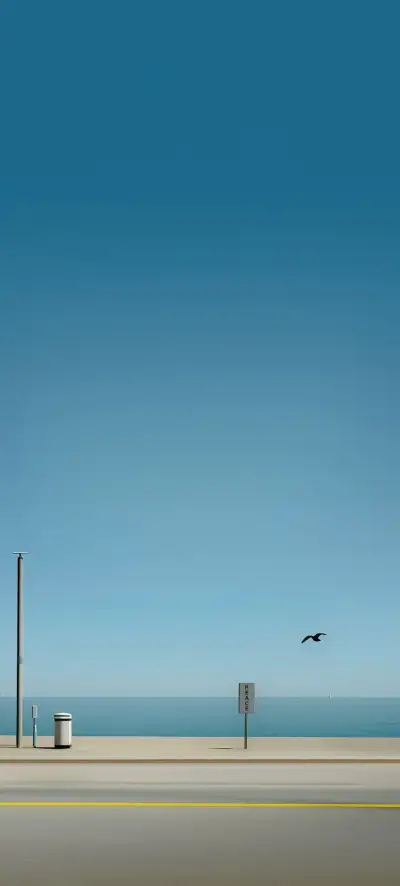 a bird flying over the ocean next to a street sign and trash can on the side of the road